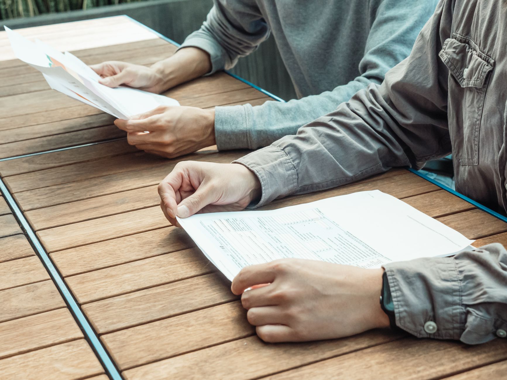 Professional reviewing legal and regulatory documents at a desk